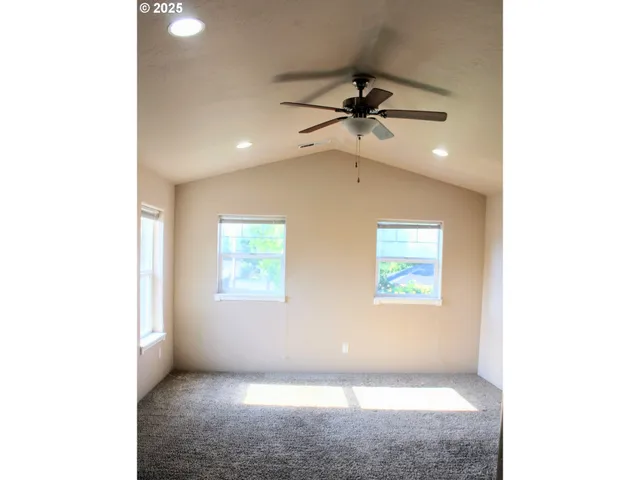 a view of an empty room with a window