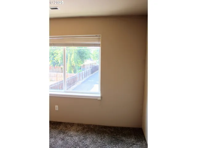 a view of a room that has a window in it