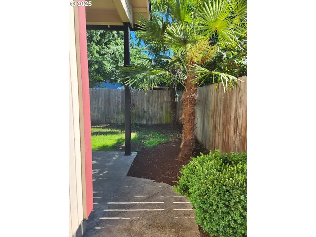 a backyard of a house with lots of green space