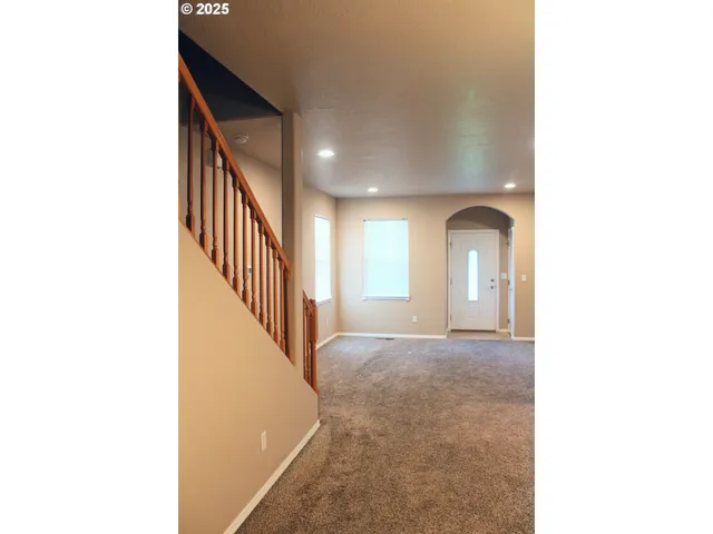 a view of a hallway with windows