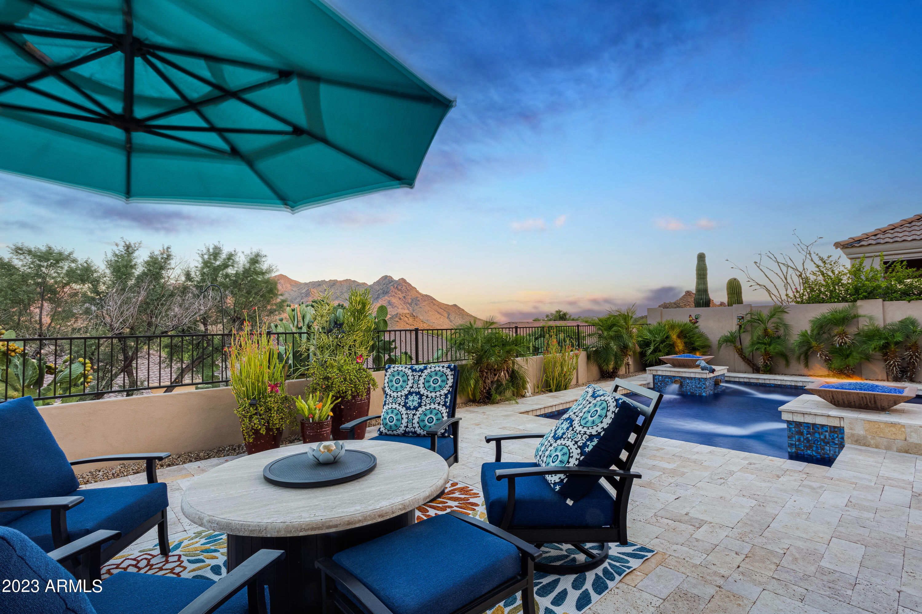 11523 East Ranch Gate Road Scottsdale, AZ 85255 - Photo 42 of 55 Pool Seating Area Twilight