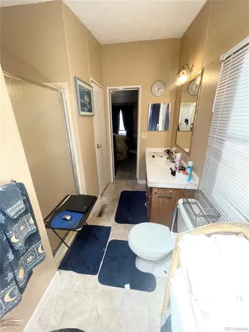 a living room with furniture and a mirror