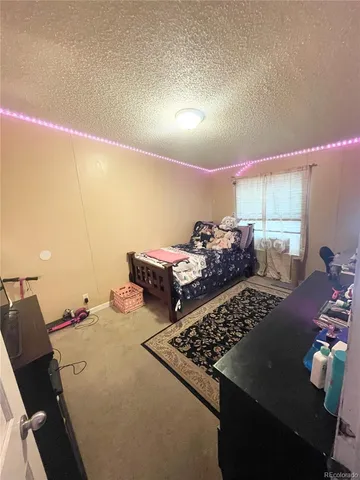 a bed room with a bed and a couch