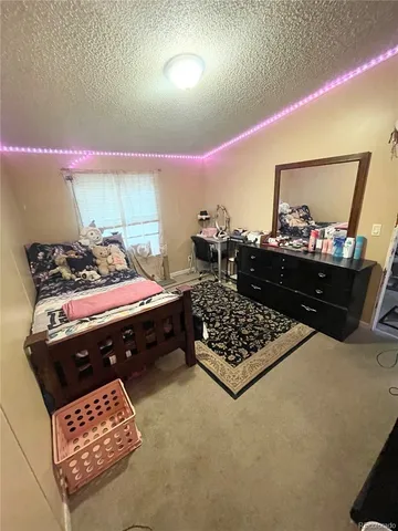 a bed room with furniture and wooden floor