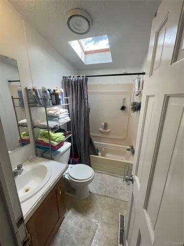 a view of a backyard with sitting area