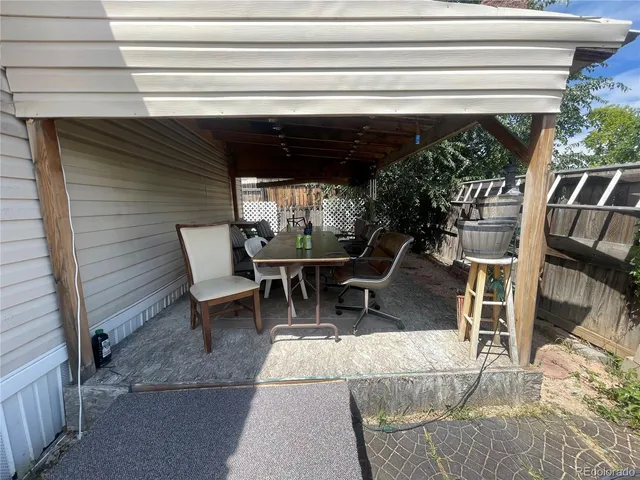 a view of a chairs and table in patio