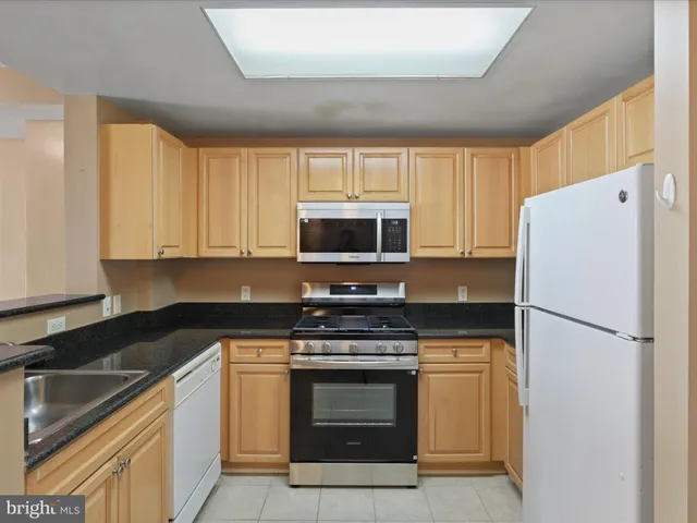 a kitchen with a stove microwave and refrigerator