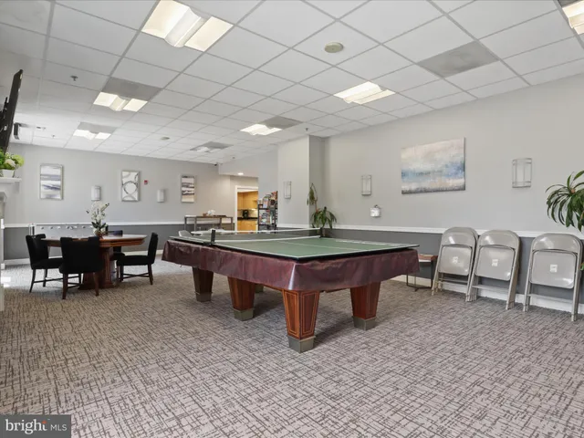 a room with furniture pool table and table soccer