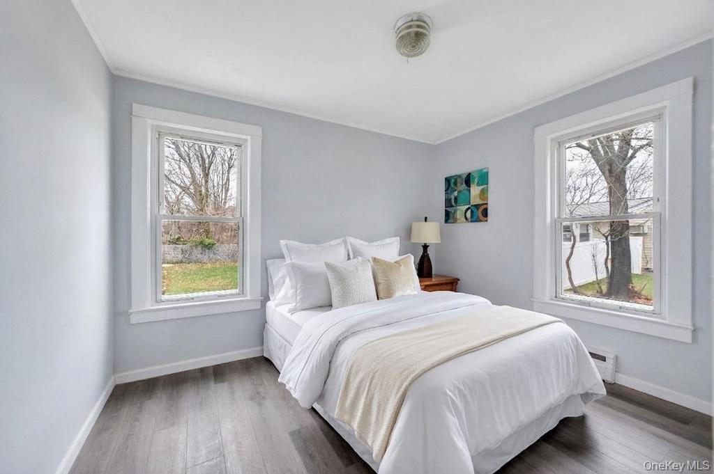 3 Adams Road Central Islip, NY 11722 - Photo 12 of 22 a bedroom with a bed and a window