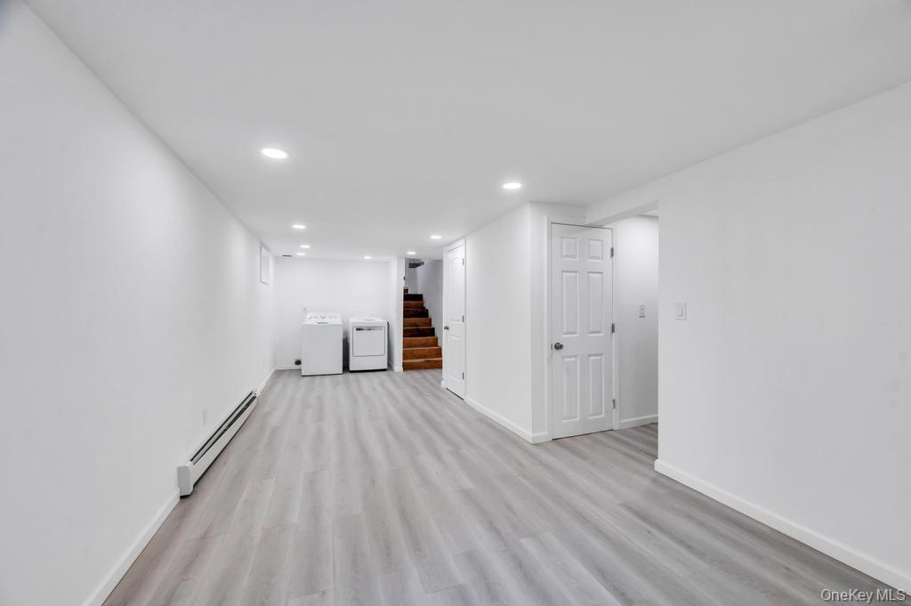 3 Adams Road Central Islip, NY 11722 - Photo 18 of 22 a view of an empty room with wooden floor