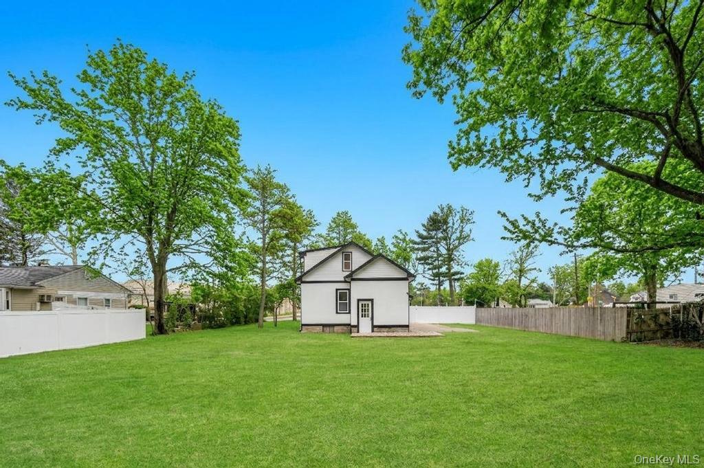 3 Adams Road Central Islip, NY 11722 - Photo 21 of 22 a view of a house with backyard and garden