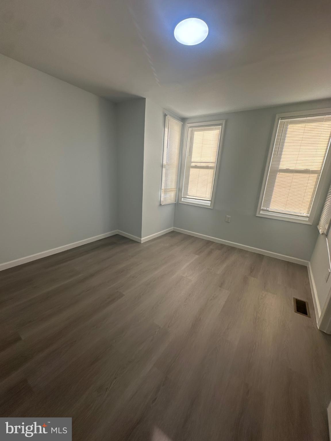5100 Cottage Street Philadelphia, PA 19124 - Photo 14 of 20 an empty room with wooden floor and windows