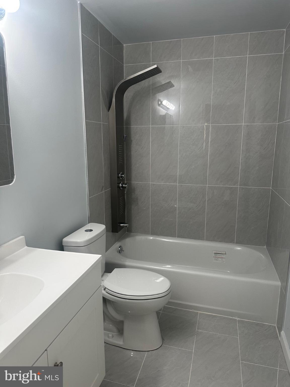 5100 Cottage Street Philadelphia, PA 19124 - Photo 17 of 20 a bathroom with a toilet and a shower