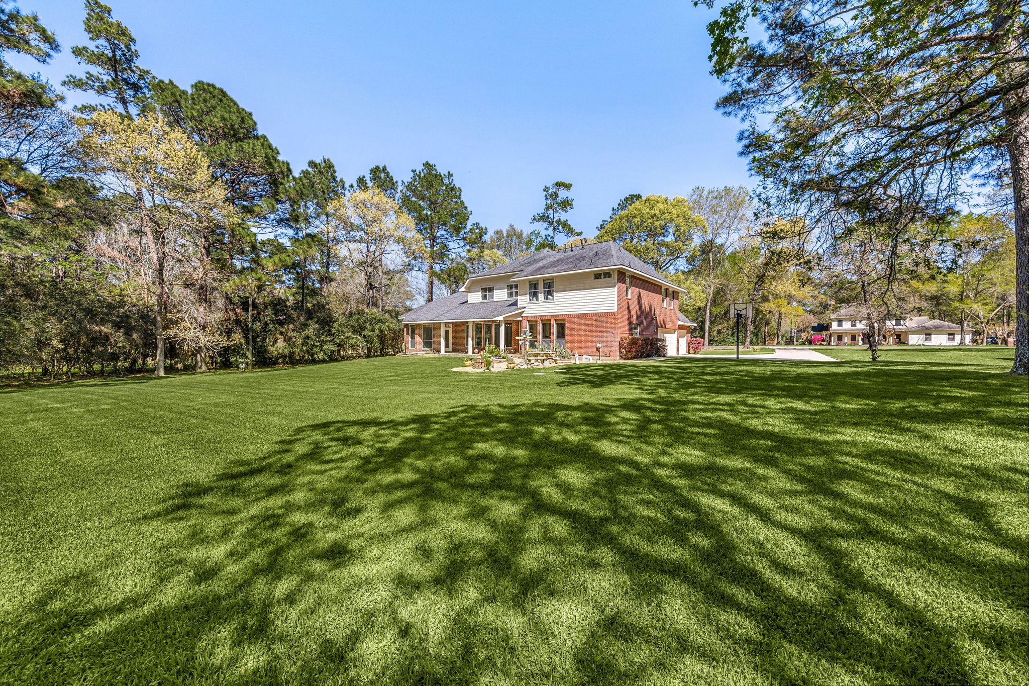 14419 Timbergreen Drive Magnolia, TX 77355 - Photo 33 of 43 Enjoy the wide-open backyard surrounded by mature trees, providing privacy, shade, and plenty of room for outdoor activities.