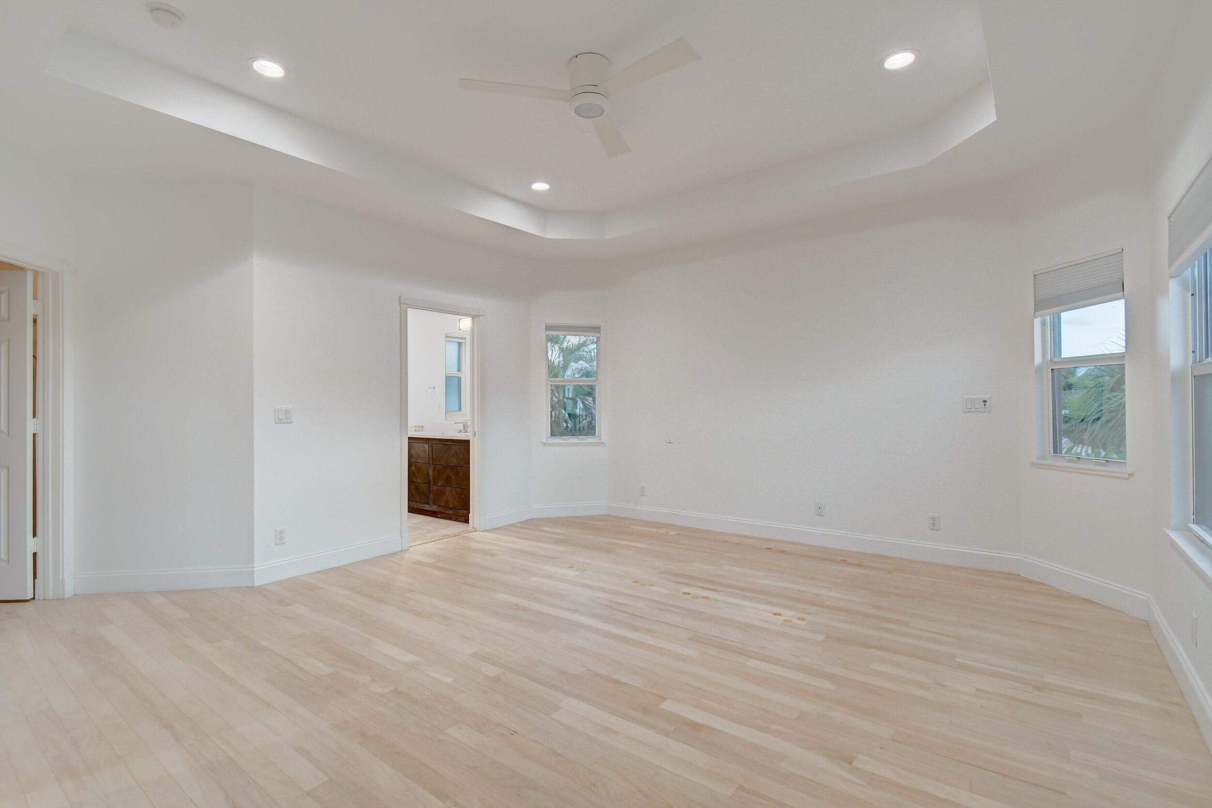 21 Oceanview Drive, Unit C Ocean Ridge, FL 33435 - Photo 14 of 17 wooden floor in an empty room with a window