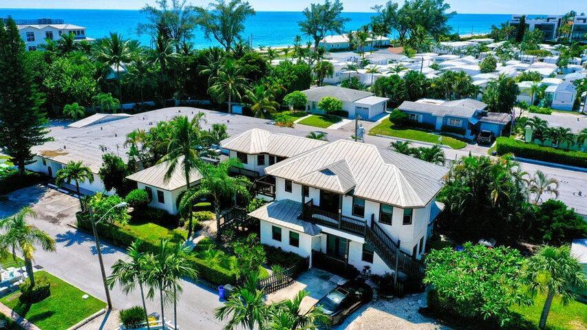 21 Oceanview Drive, Unit C Ocean Ridge, FL 33435 - Photo 2 of 17 an aerial view of multiple houses with yard
