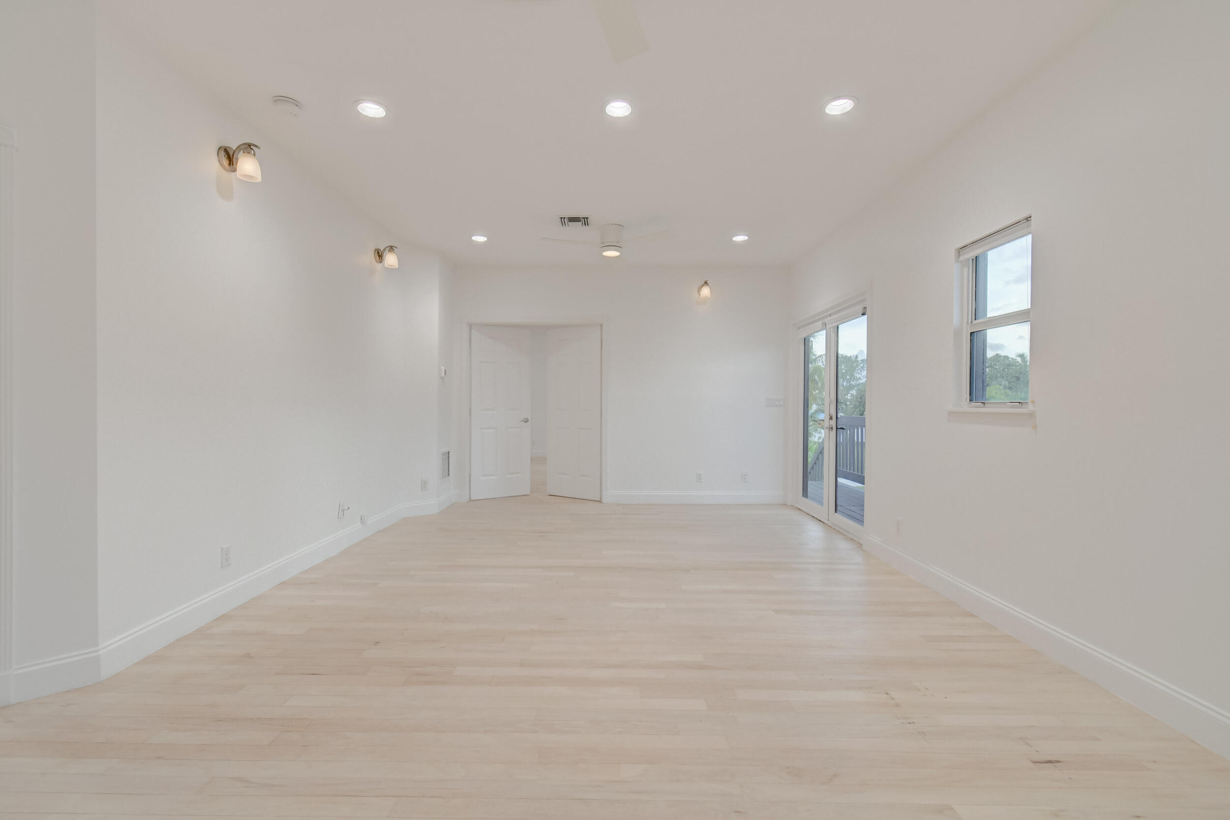 21 Oceanview Drive, Unit C Ocean Ridge, FL 33435 - Photo 9 of 17 a view of an empty room with glass door