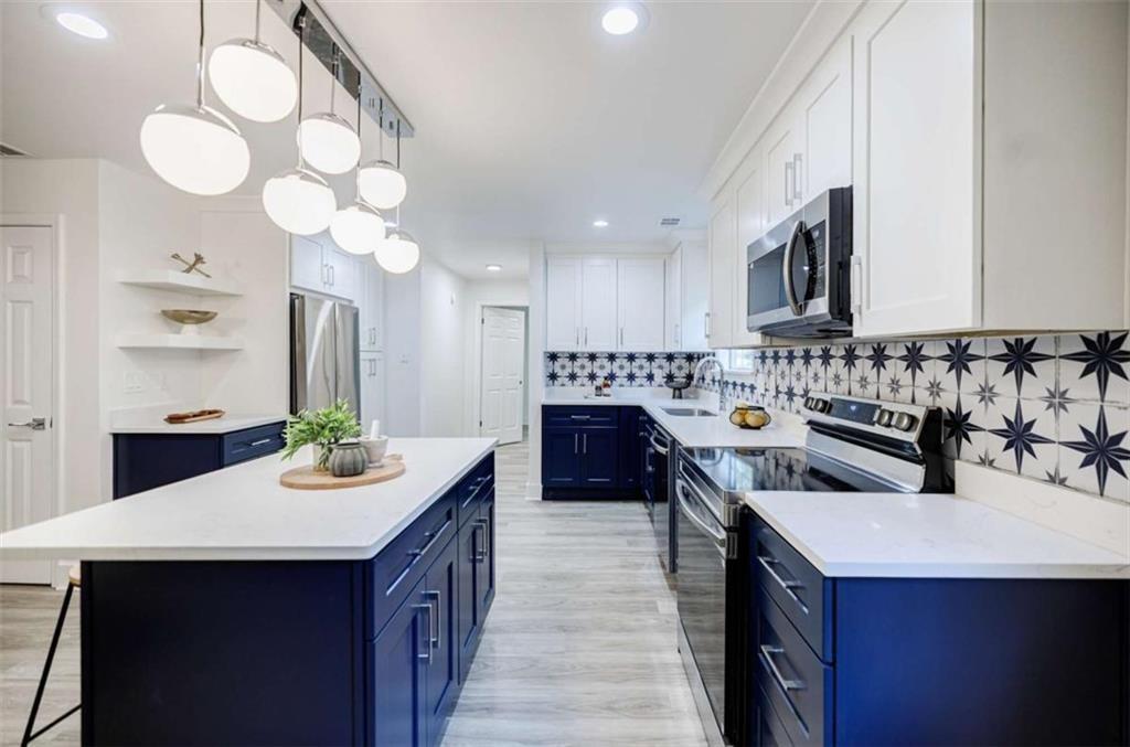 2223 Wingate Street Southwest Atlanta, GA 30310 - Photo 14 of 44 a kitchen with a sink stove and cabinets