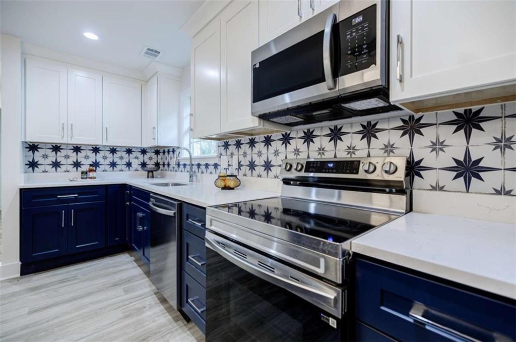 2223 Wingate Street Southwest Atlanta, GA 30310 - Photo 16 of 44 a kitchen with a stove and a microwave