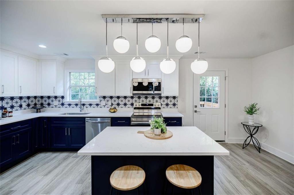 2223 Wingate Street Southwest Atlanta, GA 30310 - Photo 20 of 44 a kitchen with a table and chairs in it
