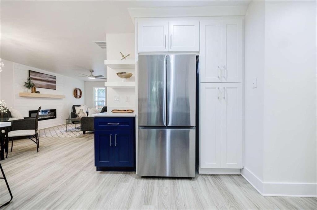 2223 Wingate Street Southwest Atlanta, GA 30310 - Photo 21 of 44 a kitchen with stainless steel appliances a refrigerator and a stove top oven