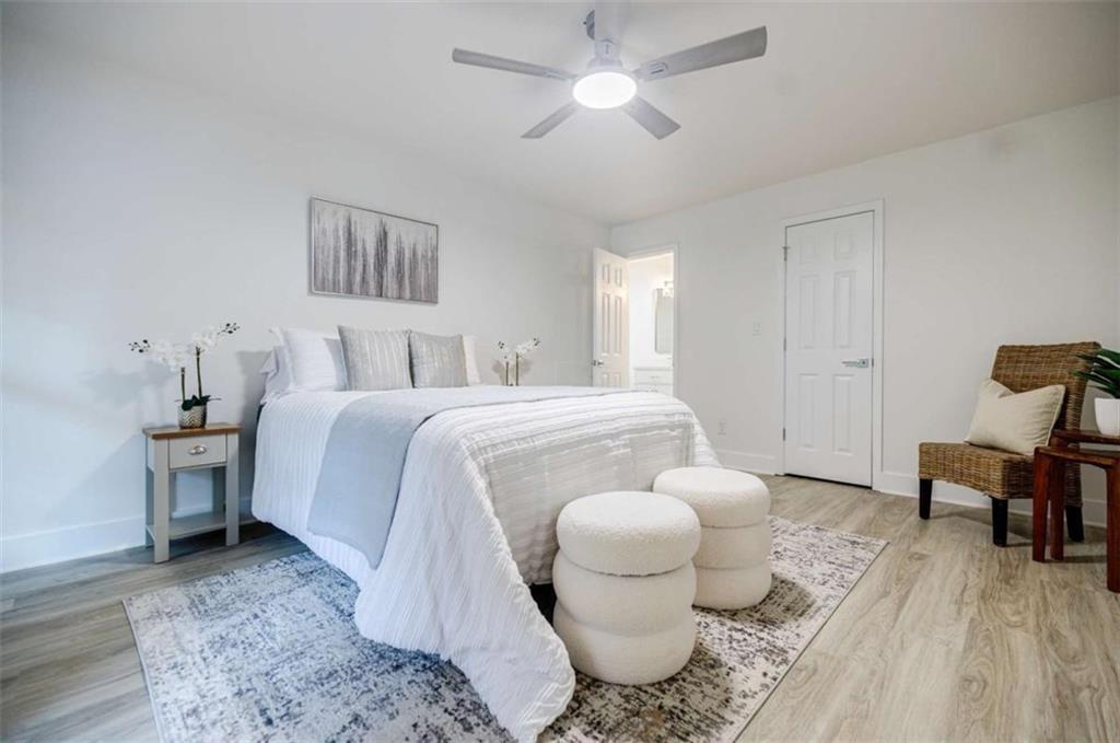 2223 Wingate Street Southwest Atlanta, GA 30310 - Photo 23 of 44 a bedroom with a bed and wooden floor