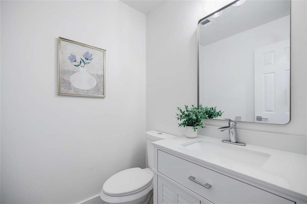 2223 Wingate Street Southwest Atlanta, GA 30310 - Photo 27 of 44 a bathroom with a sink a toilet and mirror