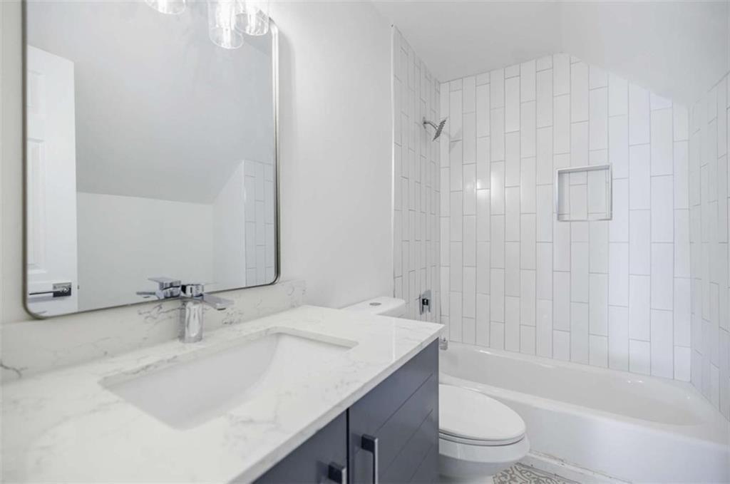 2223 Wingate Street Southwest Atlanta, GA 30310 - Photo 32 of 44 a bathroom with a sink a toilet and shower