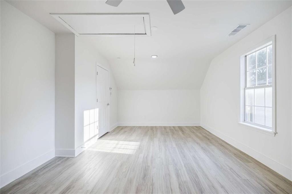 2223 Wingate Street Southwest Atlanta, GA 30310 - Photo 40 of 44 an empty room with wooden floor and windows