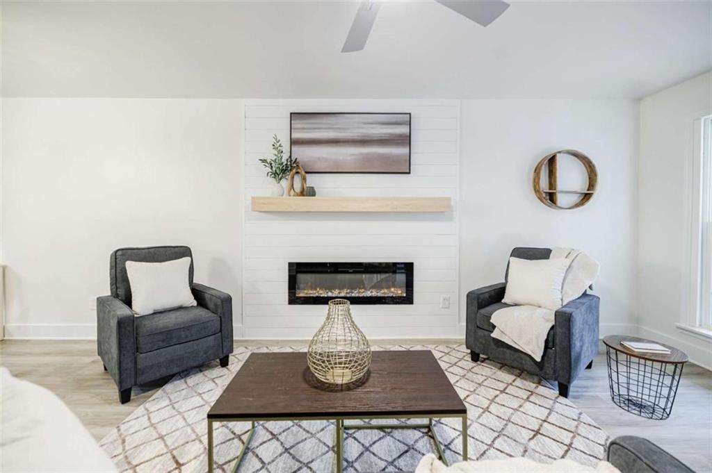 2223 Wingate Street Southwest Atlanta, GA 30310 - Photo 9 of 44 a living room with furniture and a fireplace