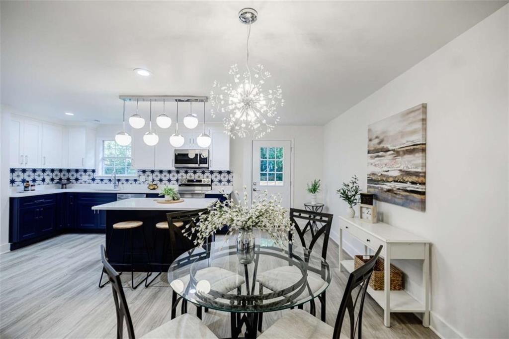 2223 Wingate Street Southwest Atlanta, GA 30310 - Photo 10 of 44 a kitchen with a table and chairs in it