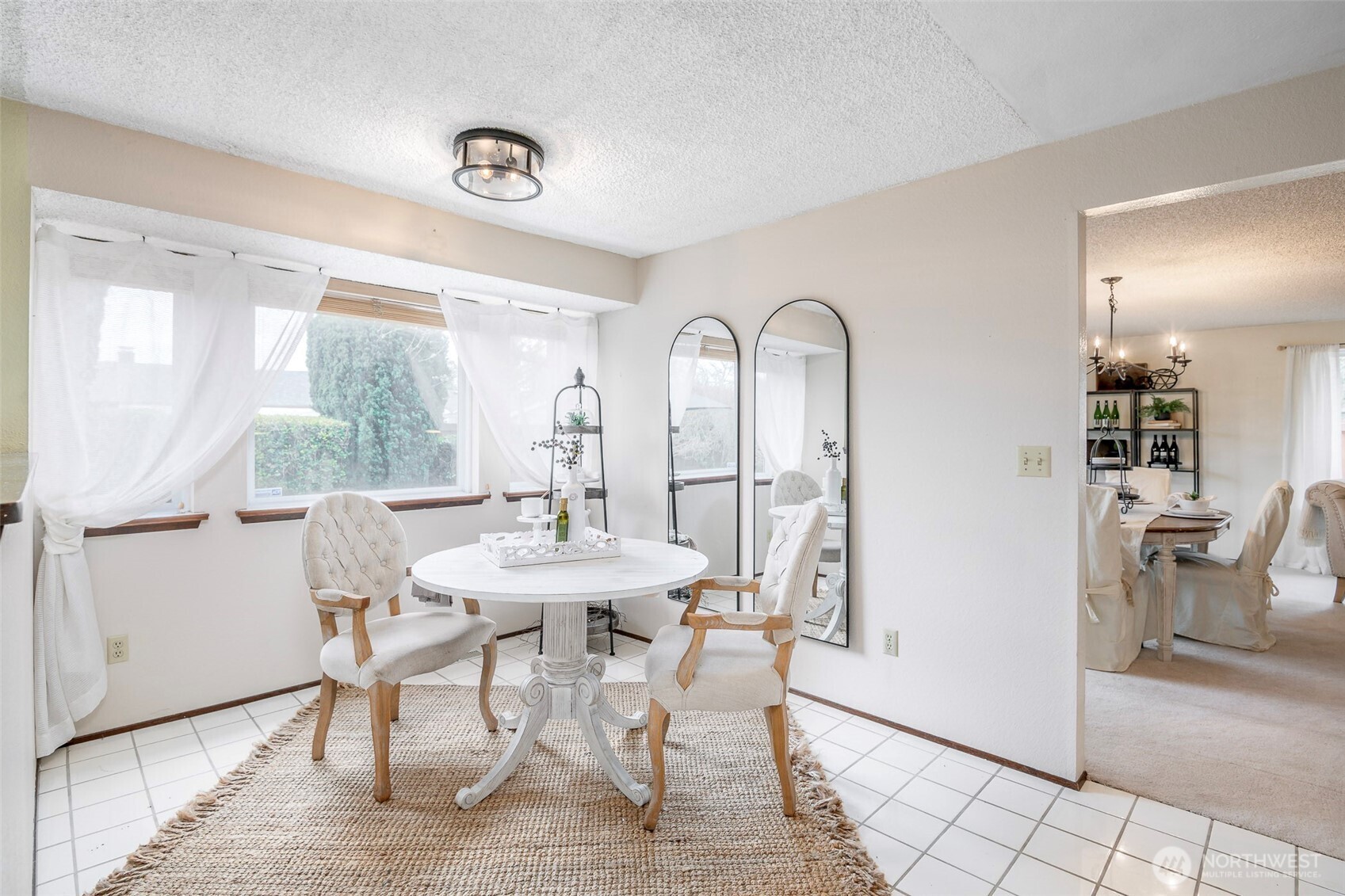 61 Bonney Street Steilacoom, WA 98388 - Photo 12 of 34 a view of a dining room with furniture and a window