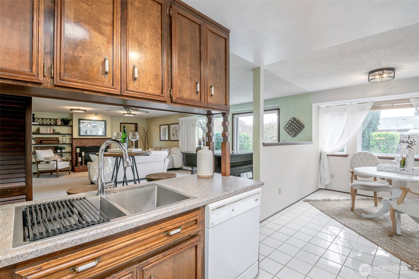 61 Bonney Street Steilacoom, WA 98388 - Photo 17 of 34 a view of kitchen with granite countertop a sink and cabinets
