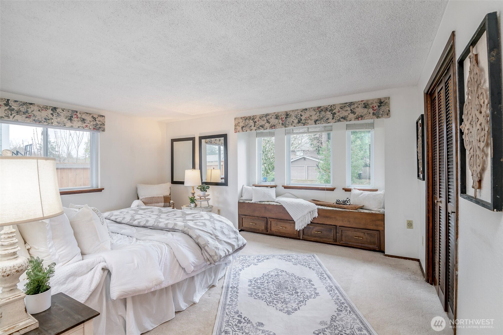 61 Bonney Street Steilacoom, WA 98388 - Photo 18 of 34 a bedroom with a bed and large windows