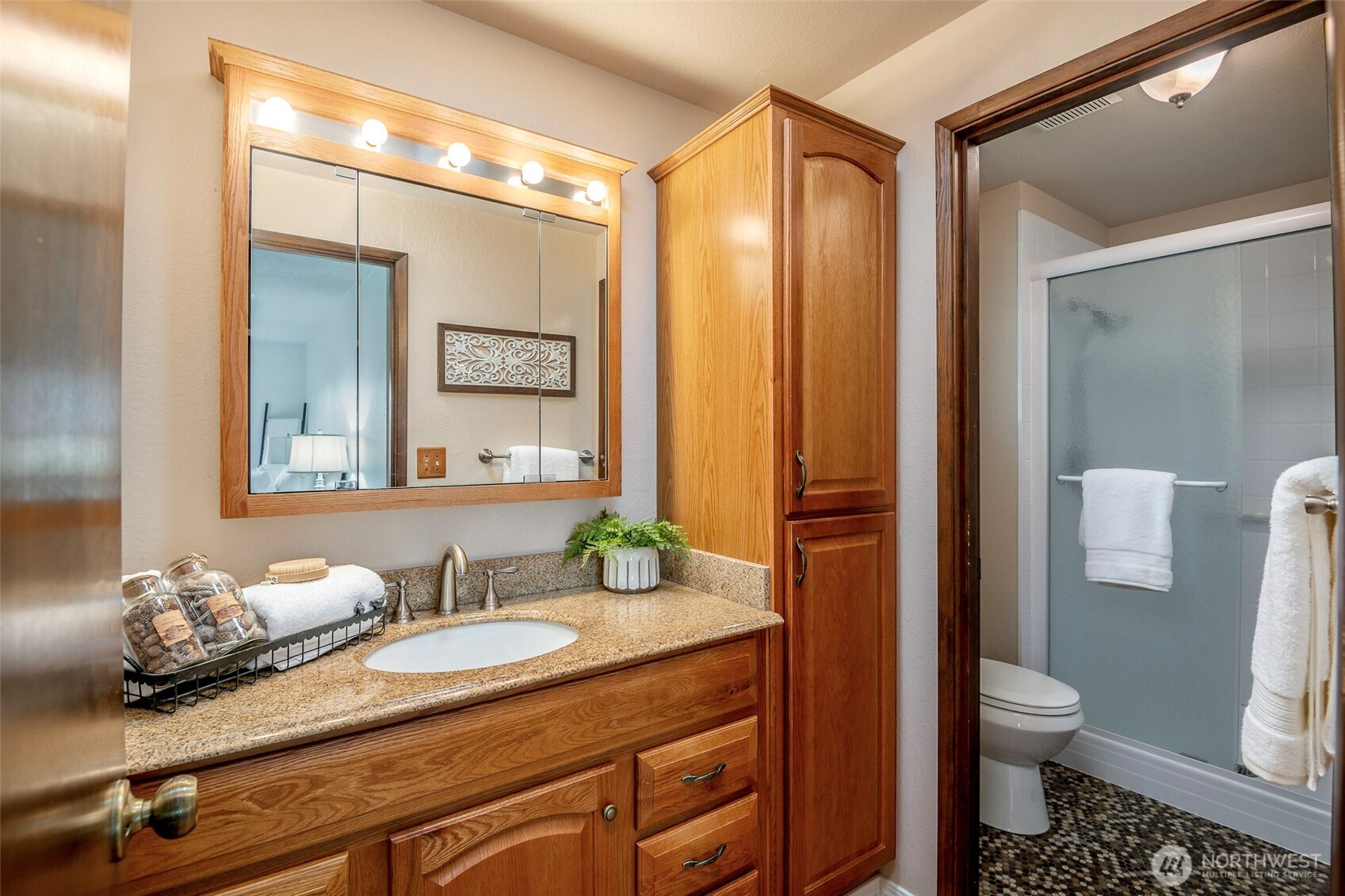61 Bonney Street Steilacoom, WA 98388 - Photo 21 of 34 a bathroom with a granite countertop sink toilet and shower