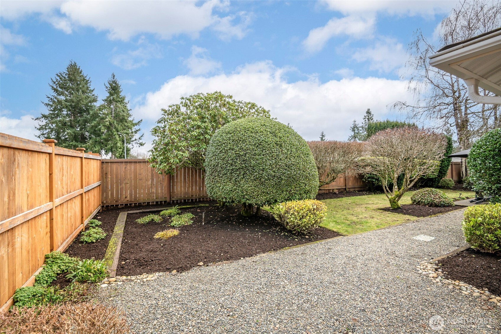 61 Bonney Street Steilacoom, WA 98388 - Photo 27 of 34 a backyard of a house with lots of green space