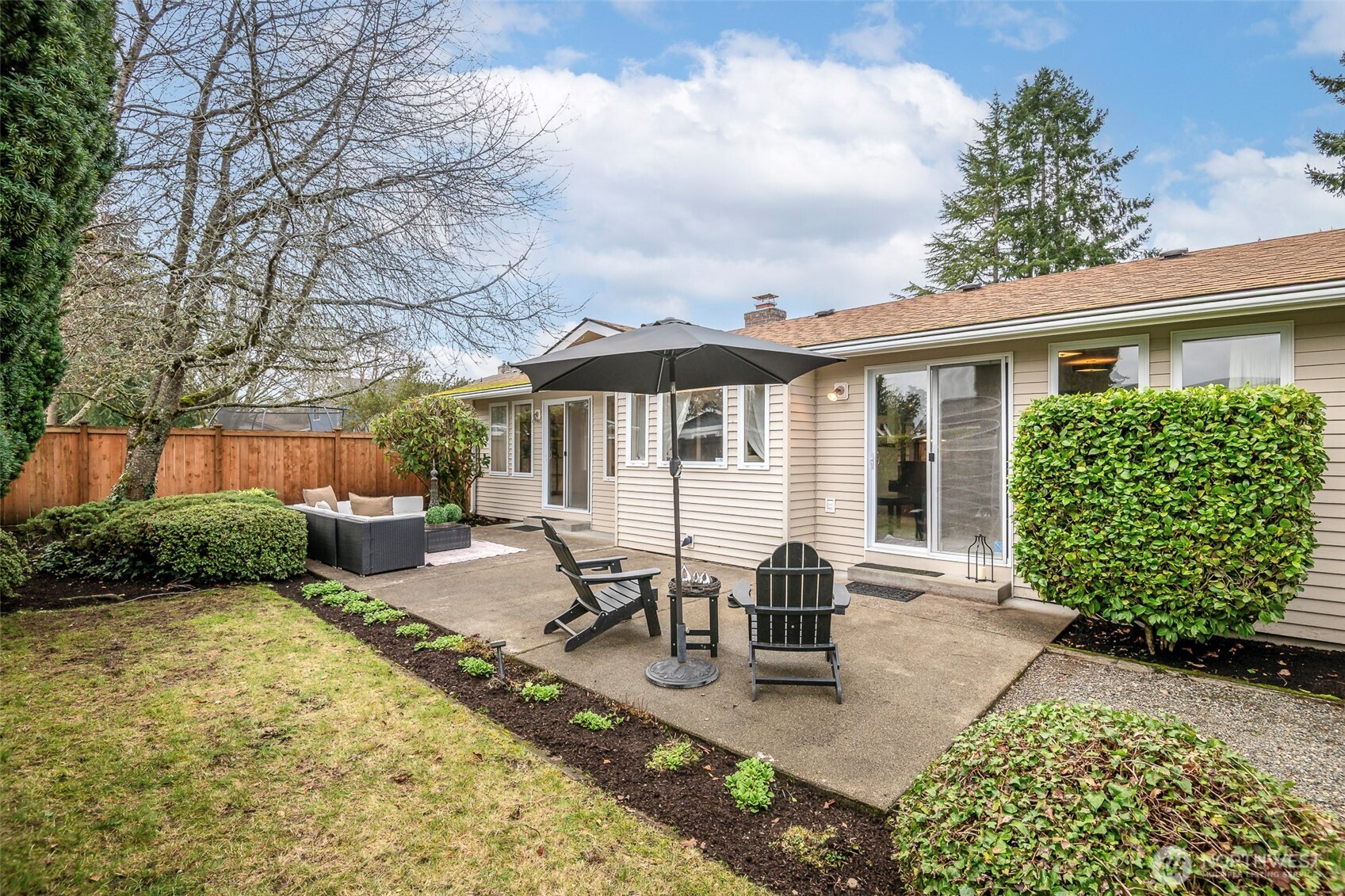 61 Bonney Street Steilacoom, WA 98388 - Photo 29 of 34 a view of a house with backyard and sitting area
