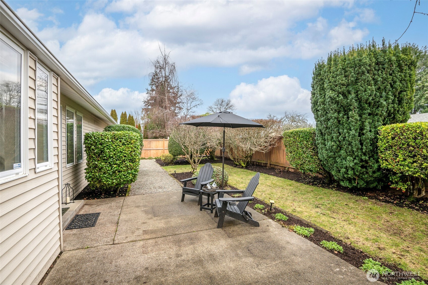 61 Bonney Street Steilacoom, WA 98388 - Photo 31 of 34 a view of a chairs and table in the back yard of the house