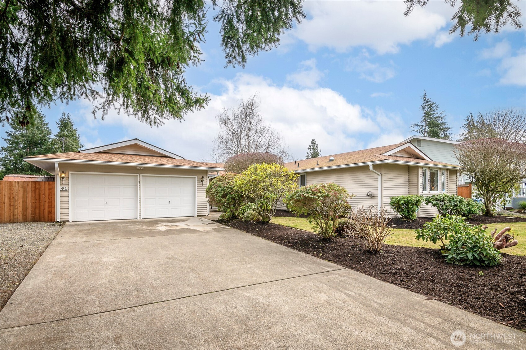 61 Bonney Street Steilacoom, WA 98388 - Photo 33 of 34 a view of a house with a yard and potted plants