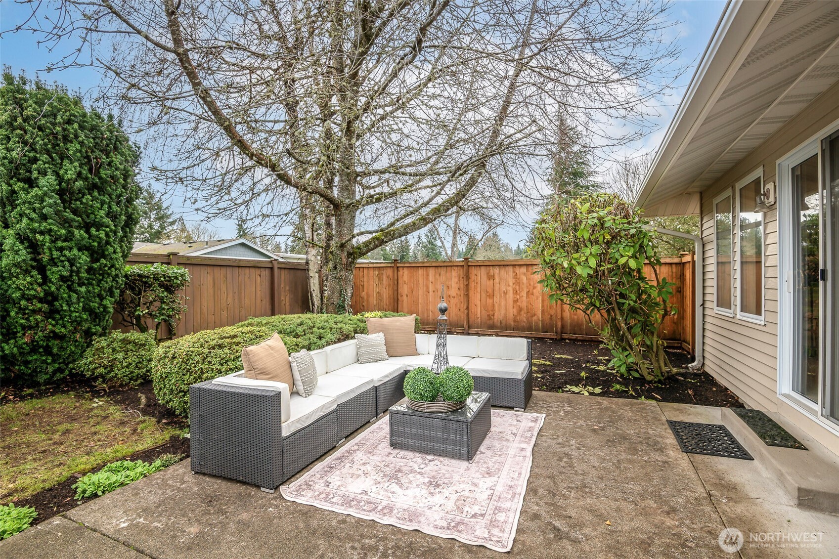 61 Bonney Street Steilacoom, WA 98388 - Photo 34 of 34 a view of a patio with couches table and chairs and potted plants