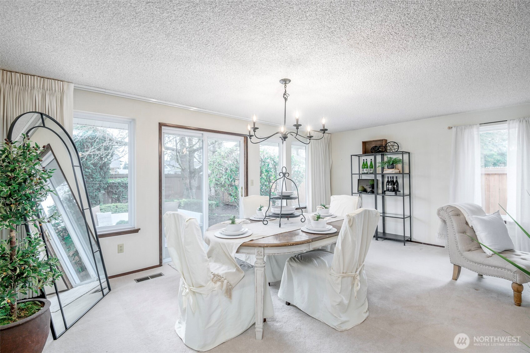 61 Bonney Street Steilacoom, WA 98388 - Photo 5 of 34 a dining room with furniture a chandelier and wooden floor
