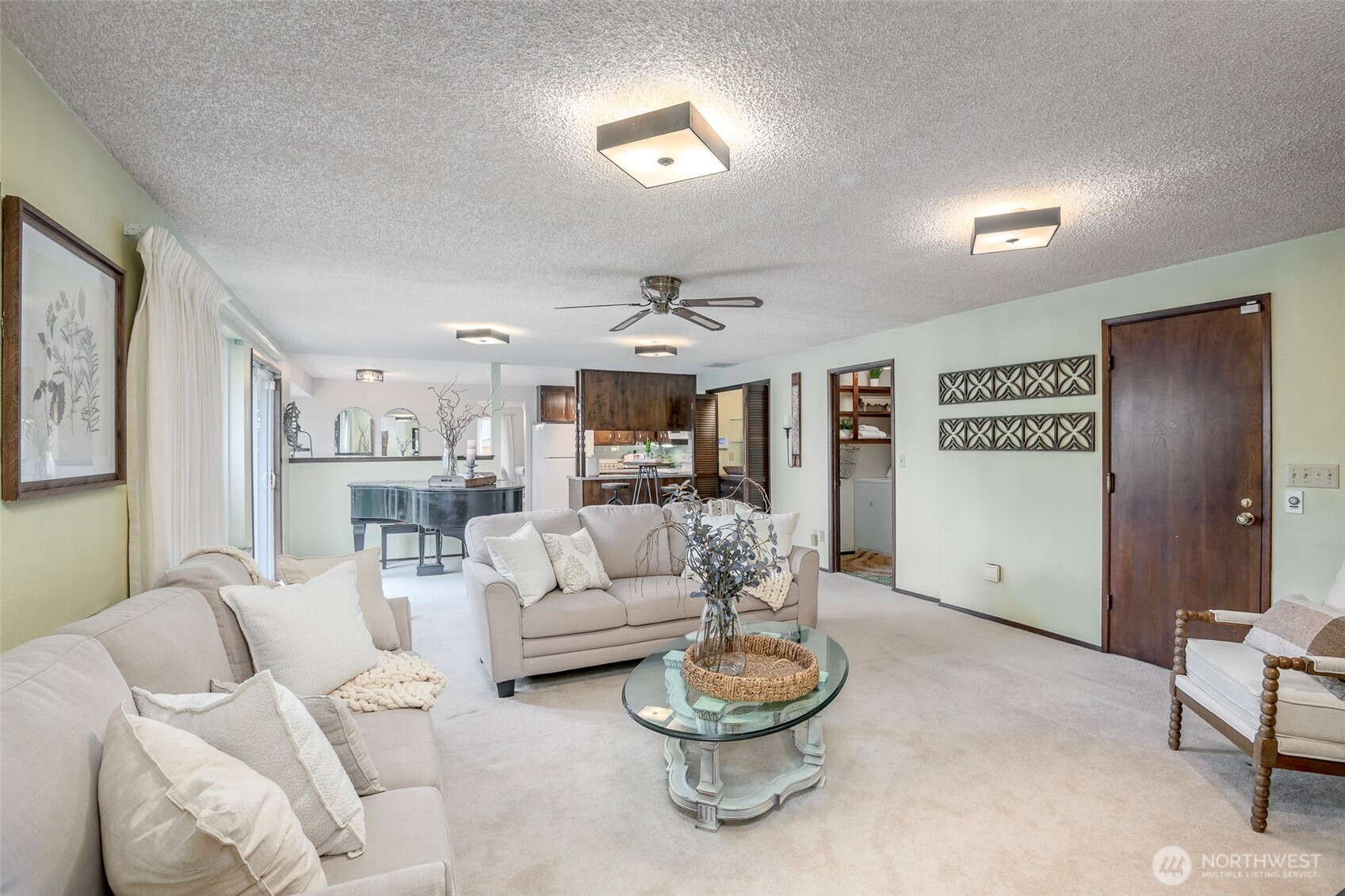 61 Bonney Street Steilacoom, WA 98388 - Photo 8 of 34 a living room with furniture and a chandelier