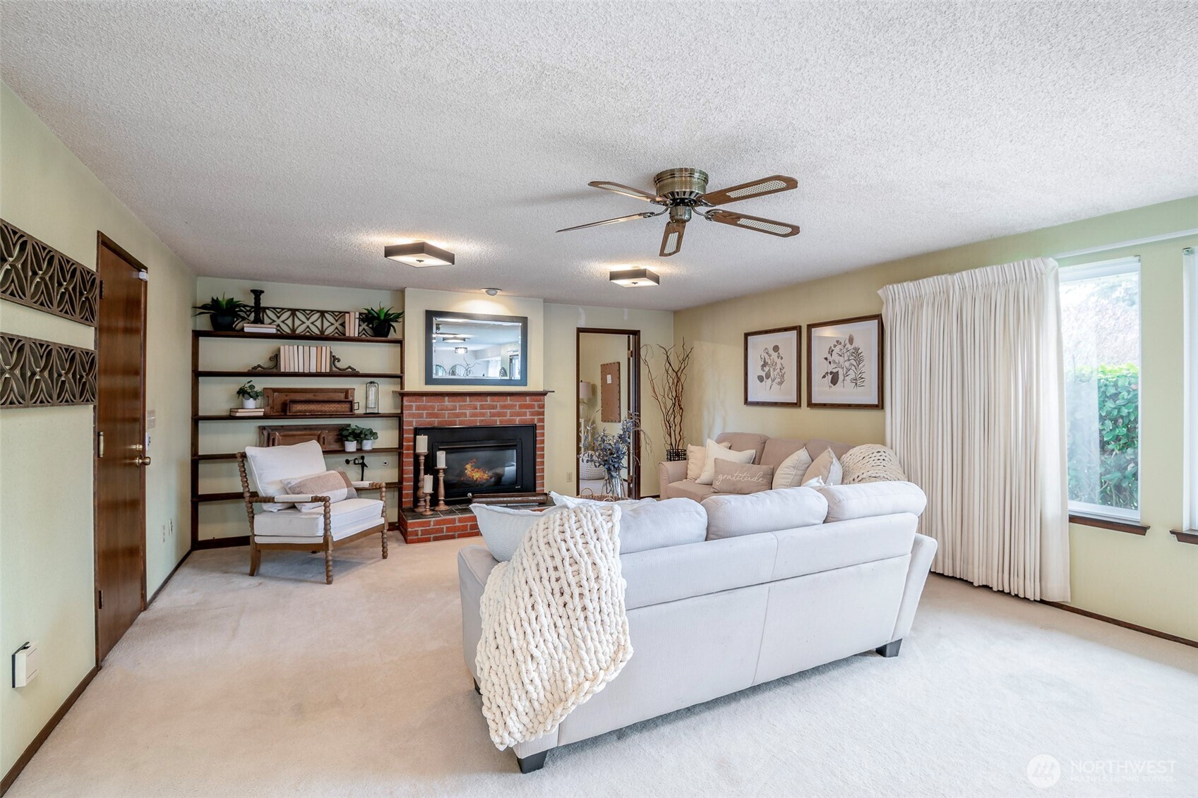 61 Bonney Street Steilacoom, WA 98388 - Photo 10 of 34 a living room with furniture and a chandelier