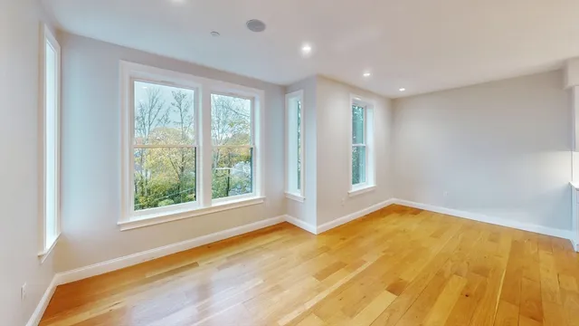 a view of an empty room with a window