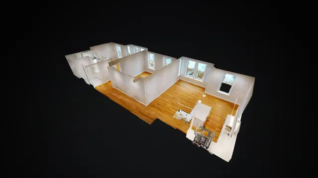 a view of water heater room with wooden floor