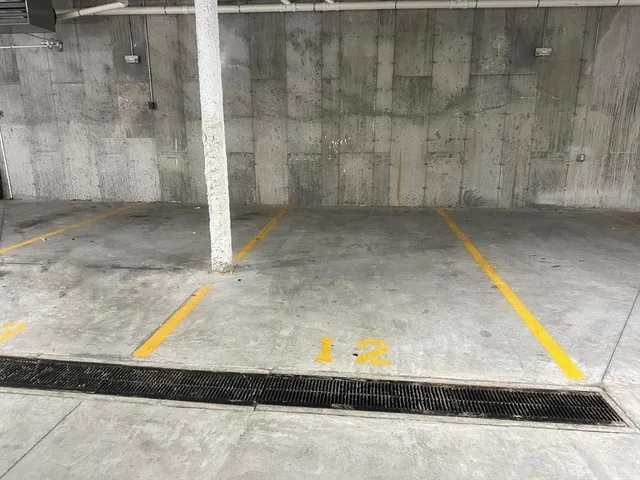 a front view of a building with parking space