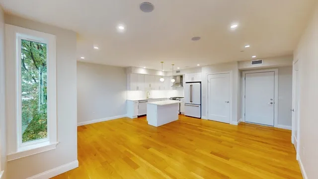 a large kitchen with a large window