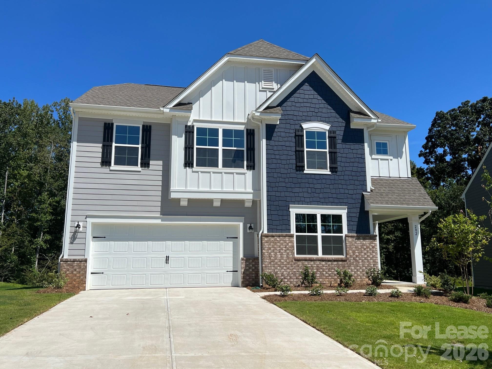 202 Tackle Troutman, NC 28166 - Photo 1 of 25 a front view of a house with a yard