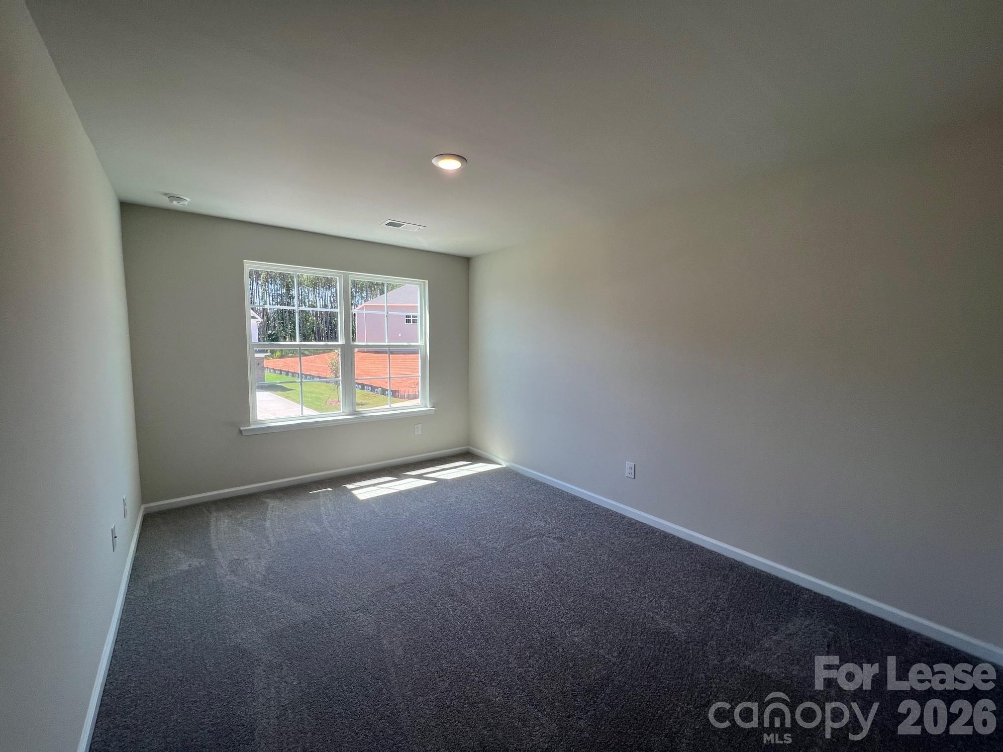 202 Tackle Troutman, NC 28166 - Photo 14 of 25 an empty room with windows