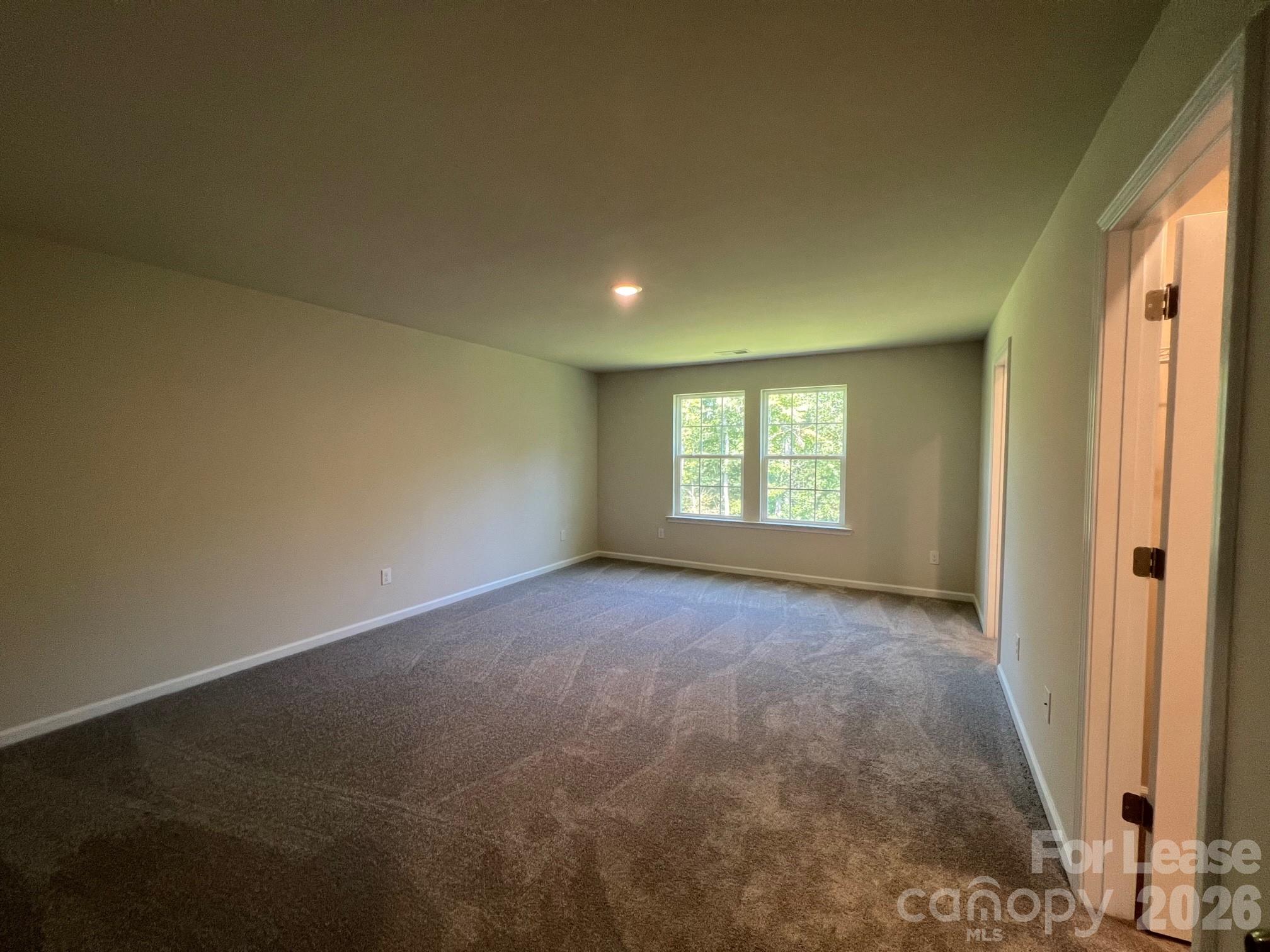 202 Tackle Troutman, NC 28166 - Photo 16 of 25 an empty room with windows